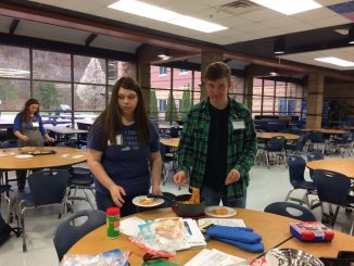 Students are shown participating in a recent cooking club held by HealthCorps at Knox Central.