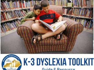 Front cover of the dyslexia toolkit showing two students reading a book.