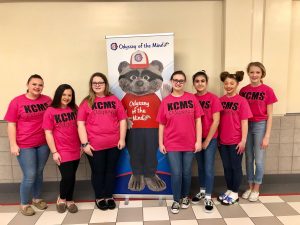 Knox County Middle School's Odyssey of the Mind team pose for a first place photo with the Omer banner behind them.