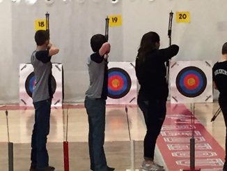 Knox County's archery members are shown taking aim at targets