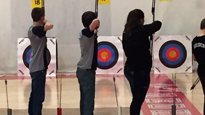 Knox County's archery members are shown taking aim at targets