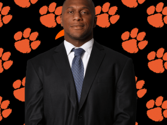 Rodney Clarke is shown in front of a LC cat paw background