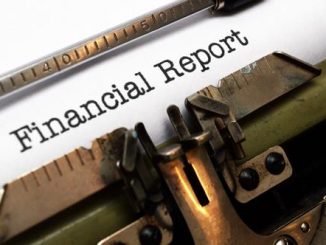 Stock image of typewriter with text Financial Report