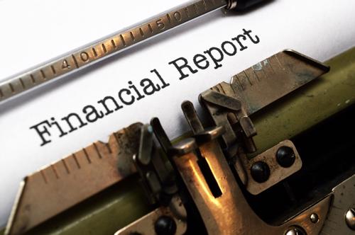 Stock image of typewriter with text Financial Report