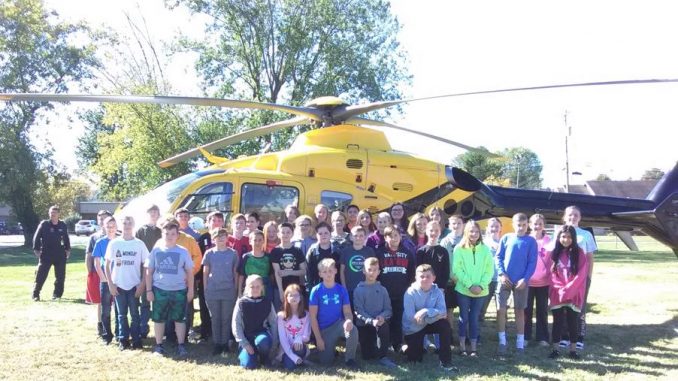 Lay students posed for a photo in front of the Air Medic helicopter as part of school safety week