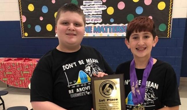 Two students from Dewitt Elementary hold the overall first place winning plaque.