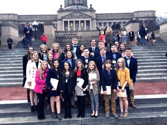 KCMS students pose in front of the Capitol during their visit to KYA.