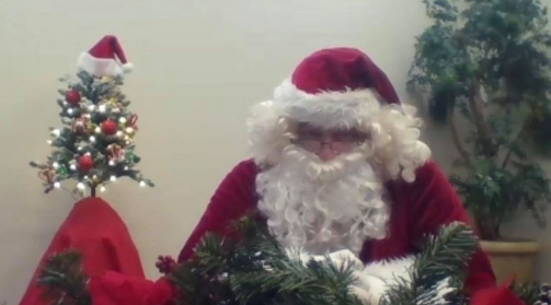 Santa is shown set up ready to take video calls from children.