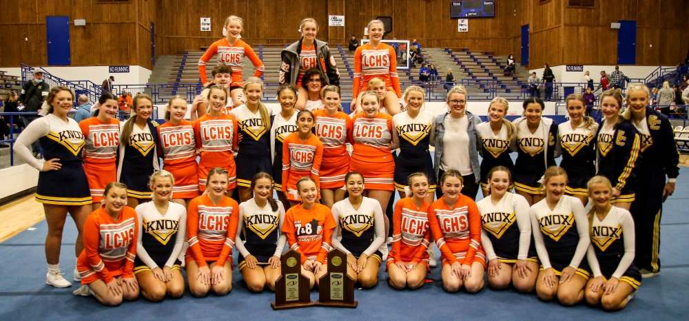 Lynn Camp and Knox Central cheerleaders pose with first place trophies following the region 7 competition