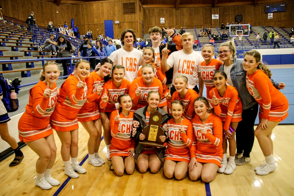 Lynn Camp's co-ed cheer squad is shown with their first place trophy.