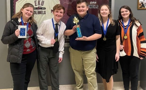 Five Lynn Camp DECA students show off their awards at the regional conference held January 2022.