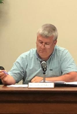 Kevin Hinkle shown at the Board