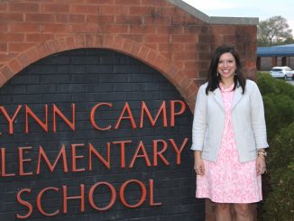 Emily Haneline poses outside of Lynn Camp Elementary