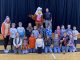 Students gather around Eddie Eagle and sponsors in the gym at Lynn Camp