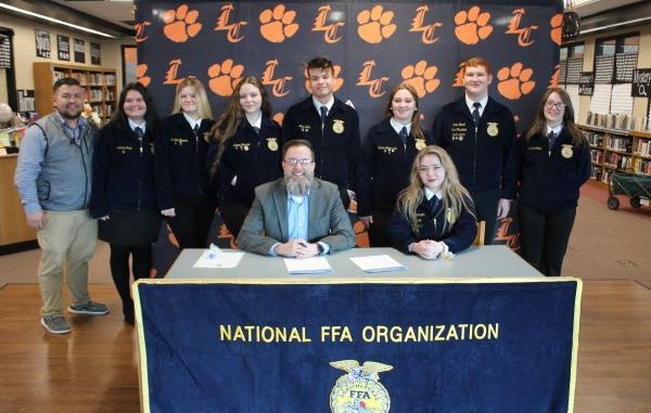 Chapter officers are shown with Superintendent Jeremy Ledford for a proclamation signing.