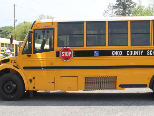 Side profile of Knox County school bus showing stop sign.