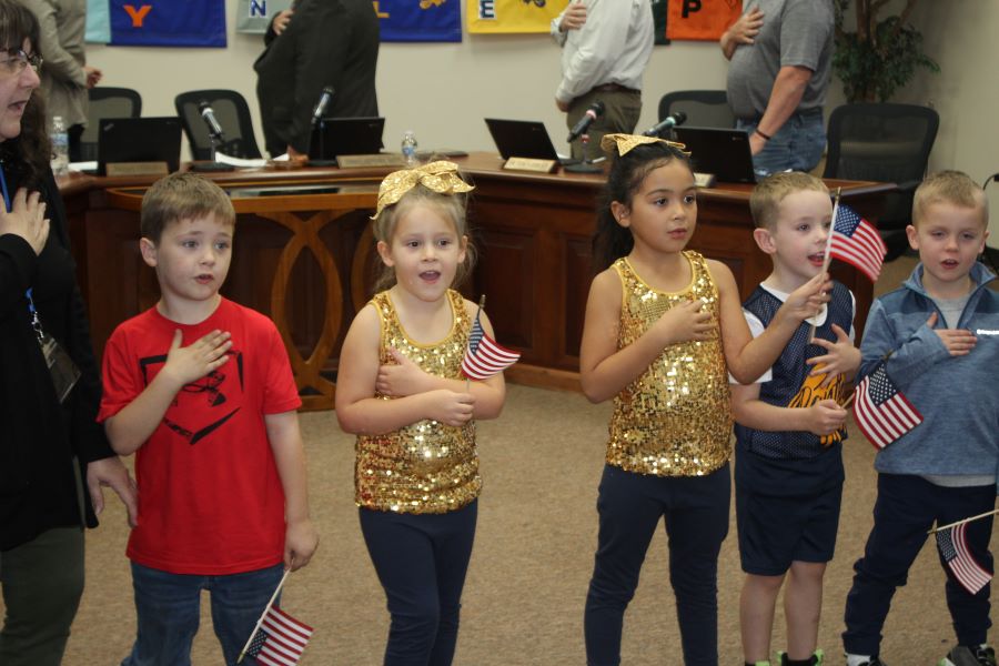 Students at Central Elementary are shown leading the Pledge of Allegiance at the November board meeting.